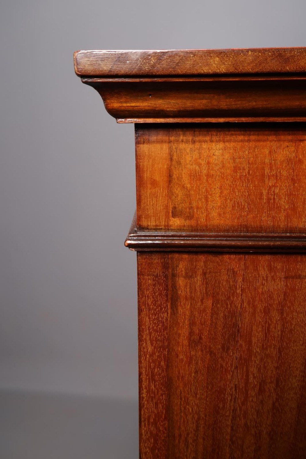 An Edwardian open-front mahogany bookcase featuring four wide shelves and decorative inlaid borders along the frame. View IX