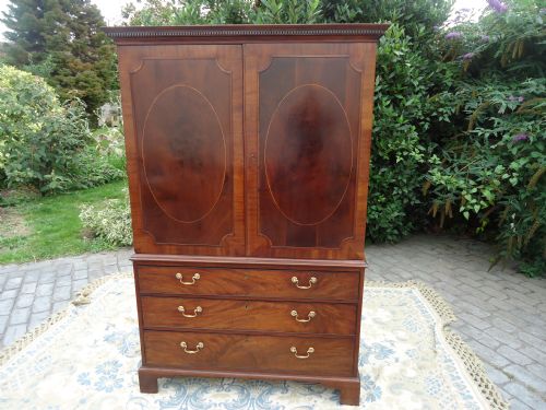 Oval Panelled Mahogany Linen Press