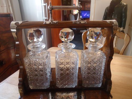 Fine Edwardian Cut Glass Three Bottle Oak and Plated Tantalus with Bramah Lock and Key
