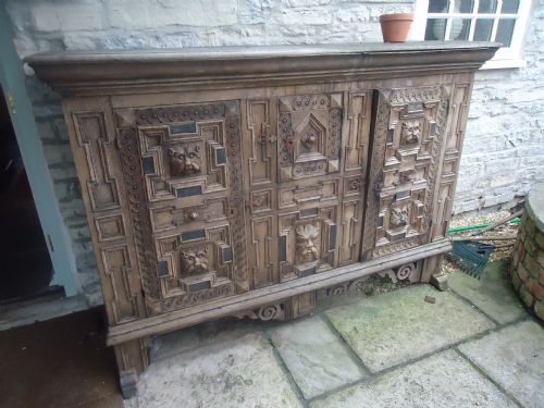 19th Century French Heavily Carved Oak Cupboard
with Masked Heads