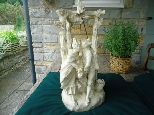 Porcelain Group Depicting Boy and Girl + Wishing Well, in the Manner of Royal Dux