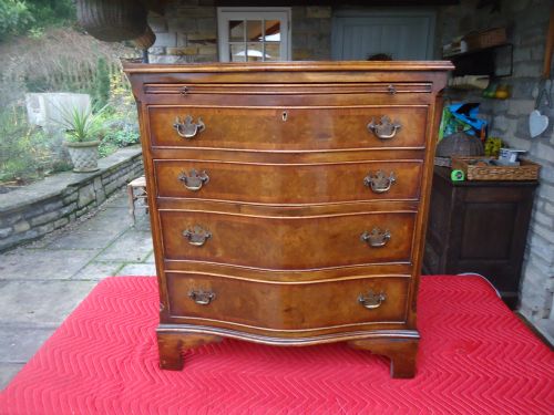 Serpentine Walnut Brushing Slide Chest of Drawers