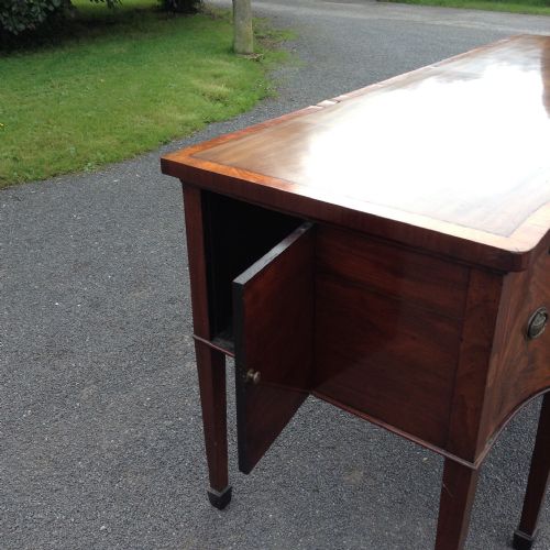 fig 1. 18th century serpentine Sheraton period mahogany sideboard