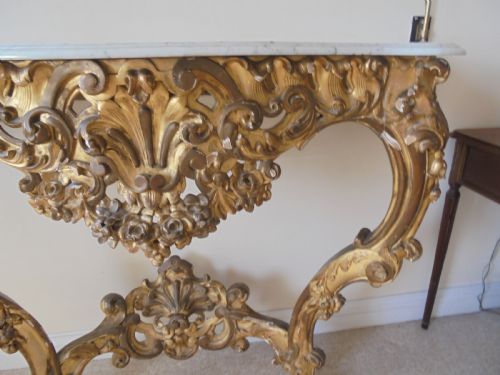 fig 1. 19th century marble top distressed gilded wood console table