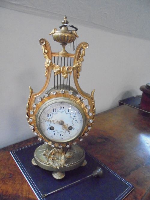 French Lyre Shape Gilded Mantle Clock with Jewelled Bezel