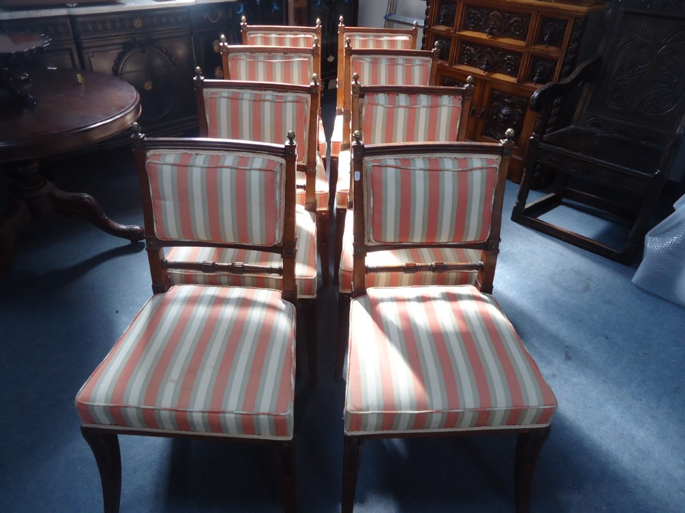 Set of eight late Regency walnut Empire style dining chairs