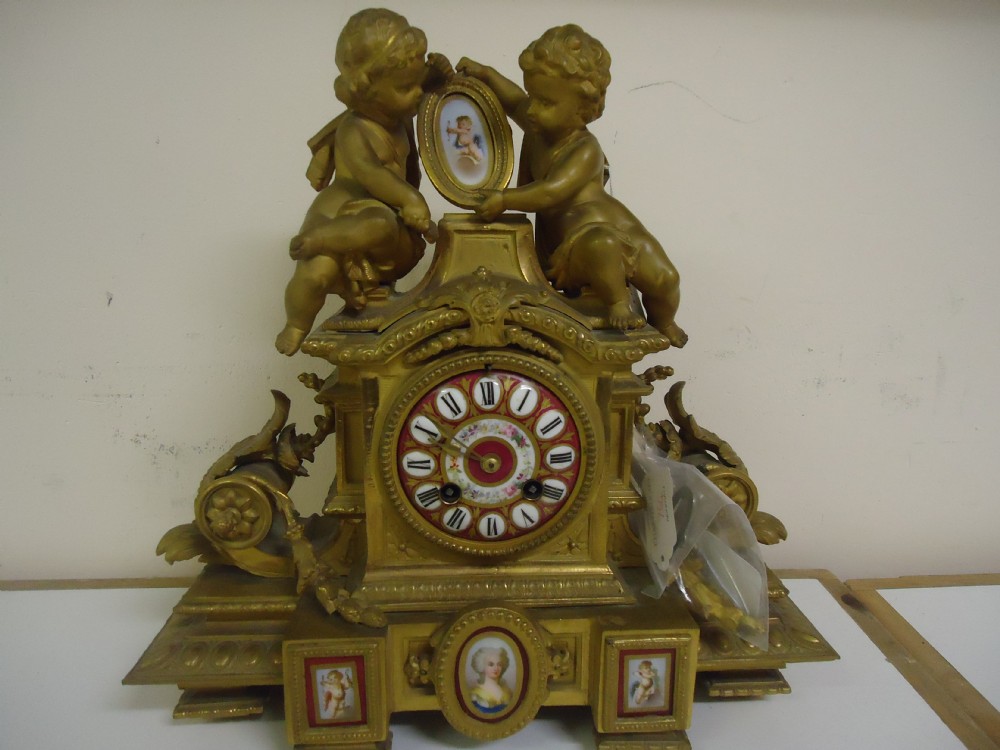 French gilded Sevres style panelled mantle clock
