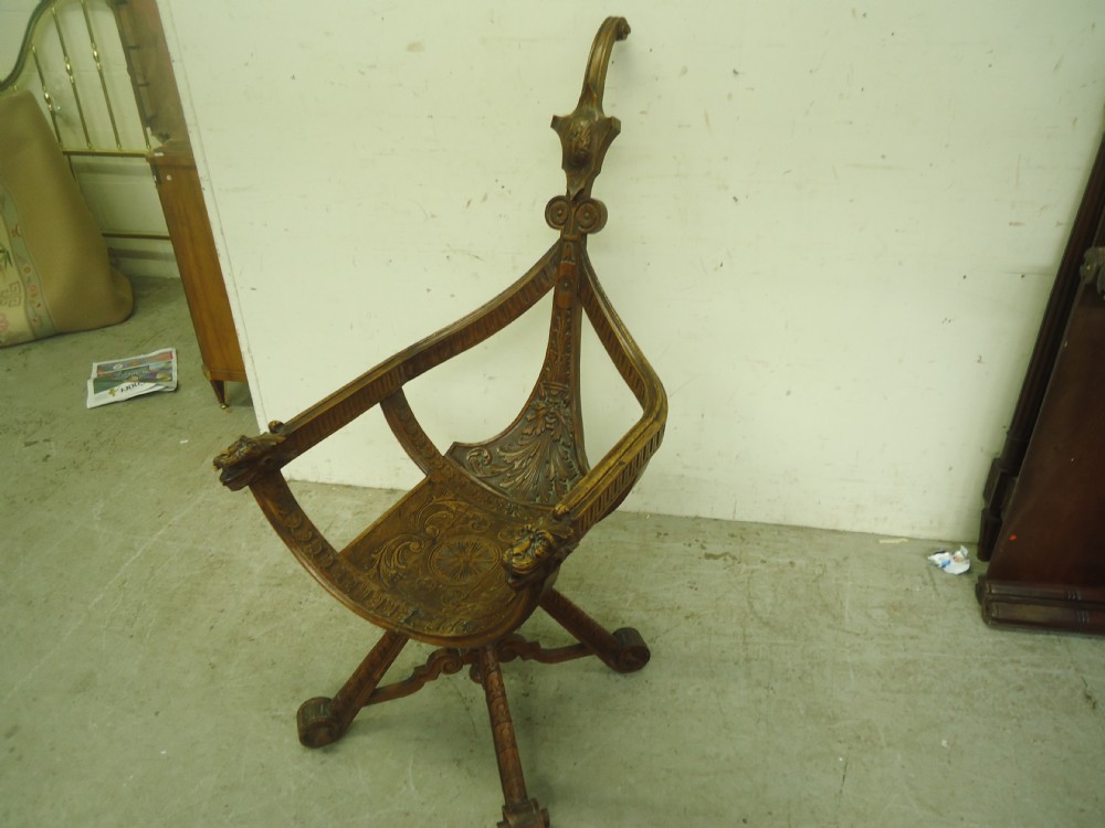 Unusual French carved walnut lion masked chair.