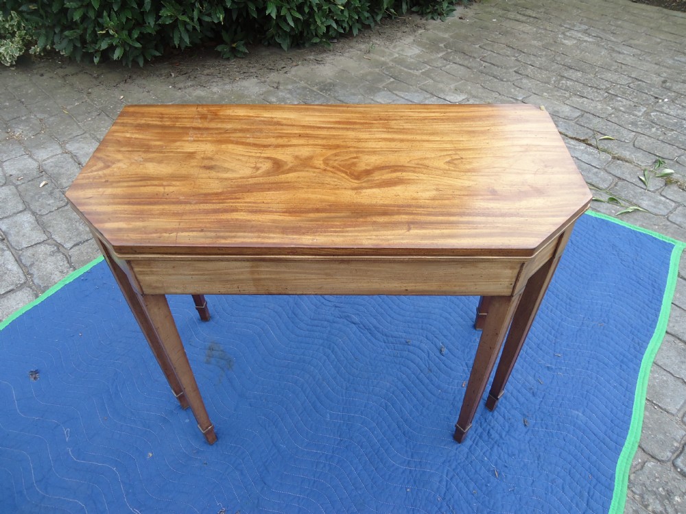 Regency six legged tea table with ebony stringing.