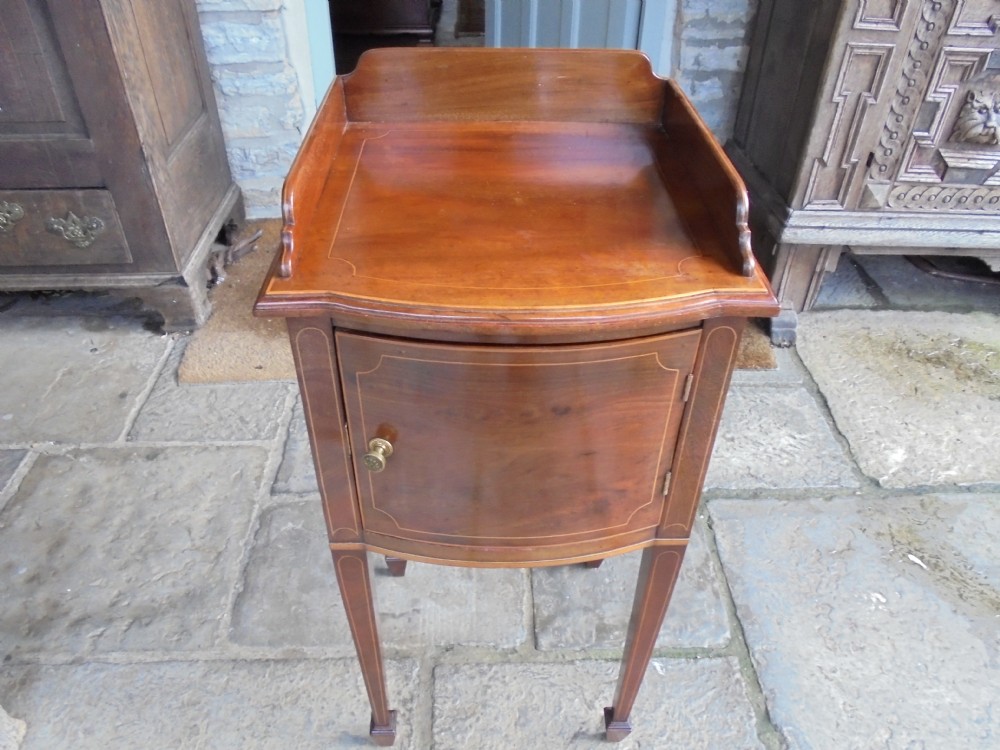 Mahogany 19th century bow fronted bedside cabinet by Heals of London