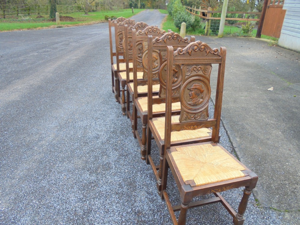 Set of six French carved oak high back dining chairs