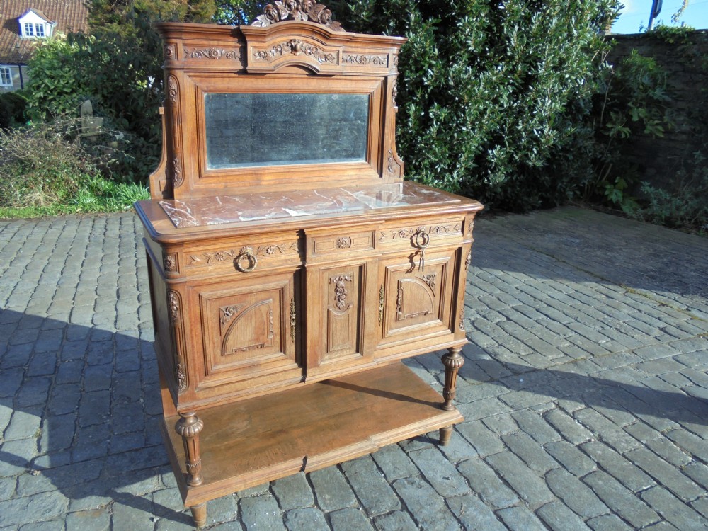French 19th century marble top mirror back oak cupboard