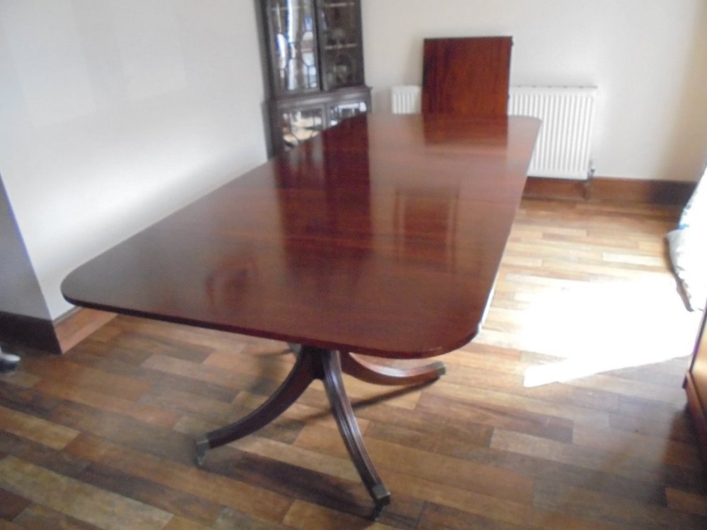 Regency style twin pillar mahogany dining table , seats twelve