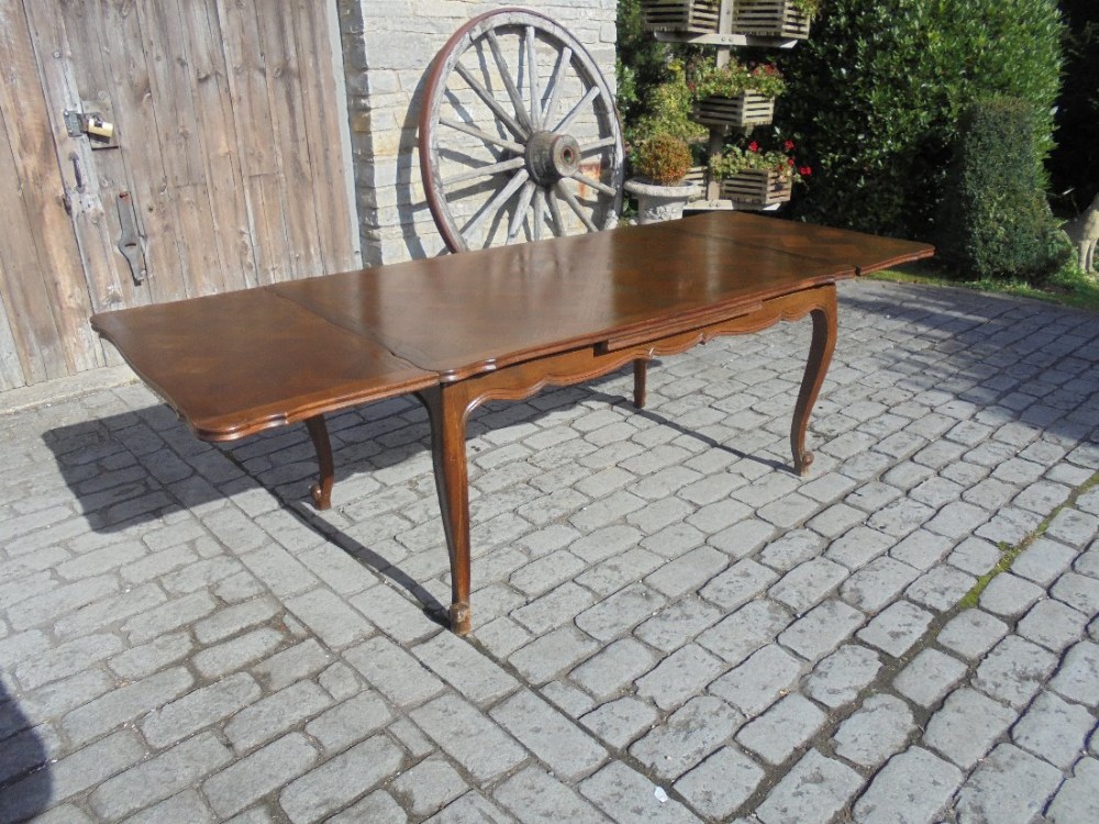 French parquetry top extension dining table , seats ten.