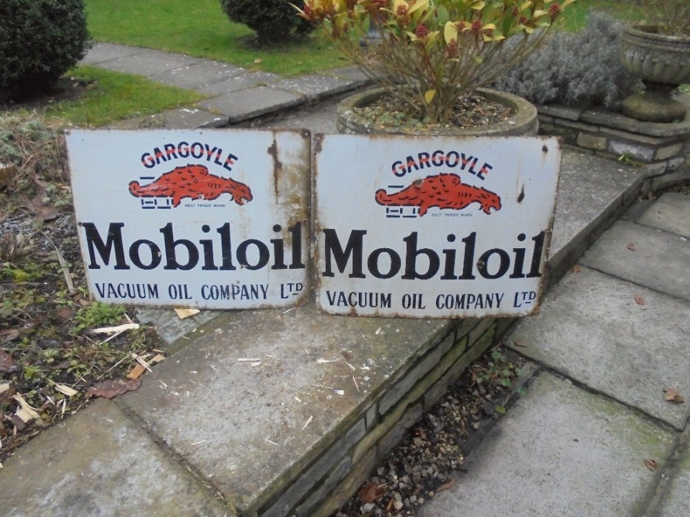 Pair of original enamel Mobiloil advertising signs