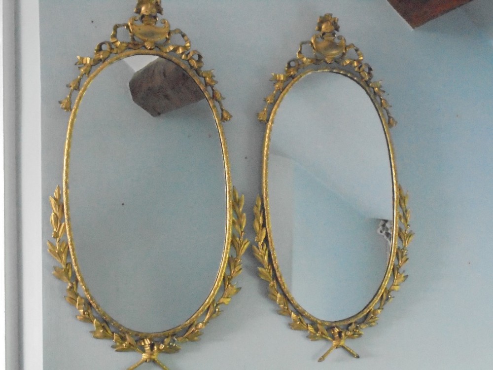 Pair of 19th century gilded bronze wall mirrors