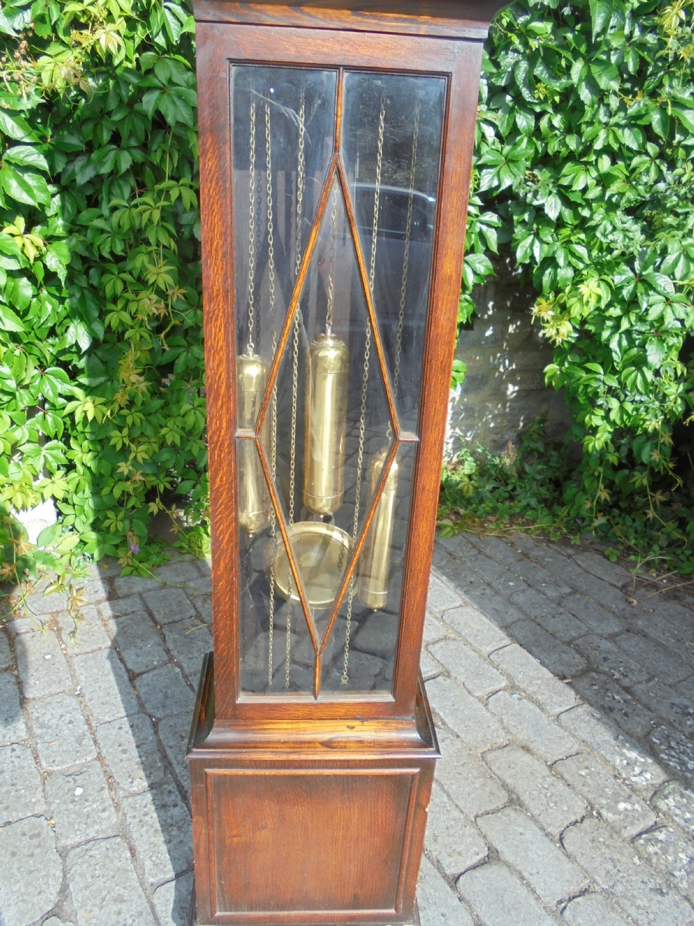 Three weight driven oak case , brass face longcase clock. circa 1900 View II