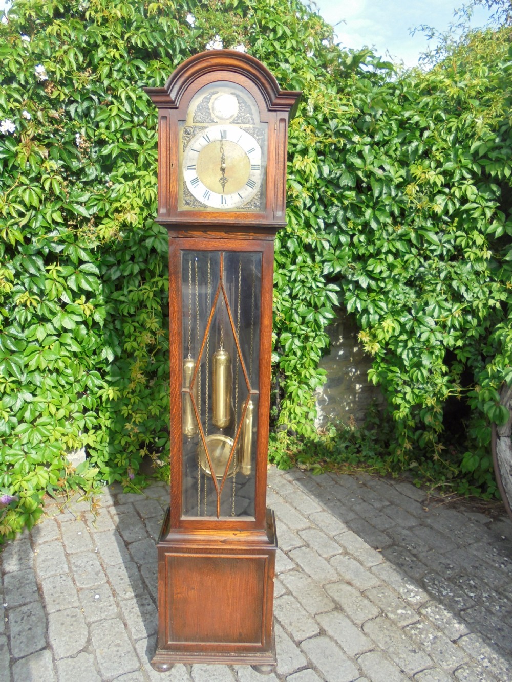 Three weight driven oak case , brass face longcase clock. circa 1900 View V
