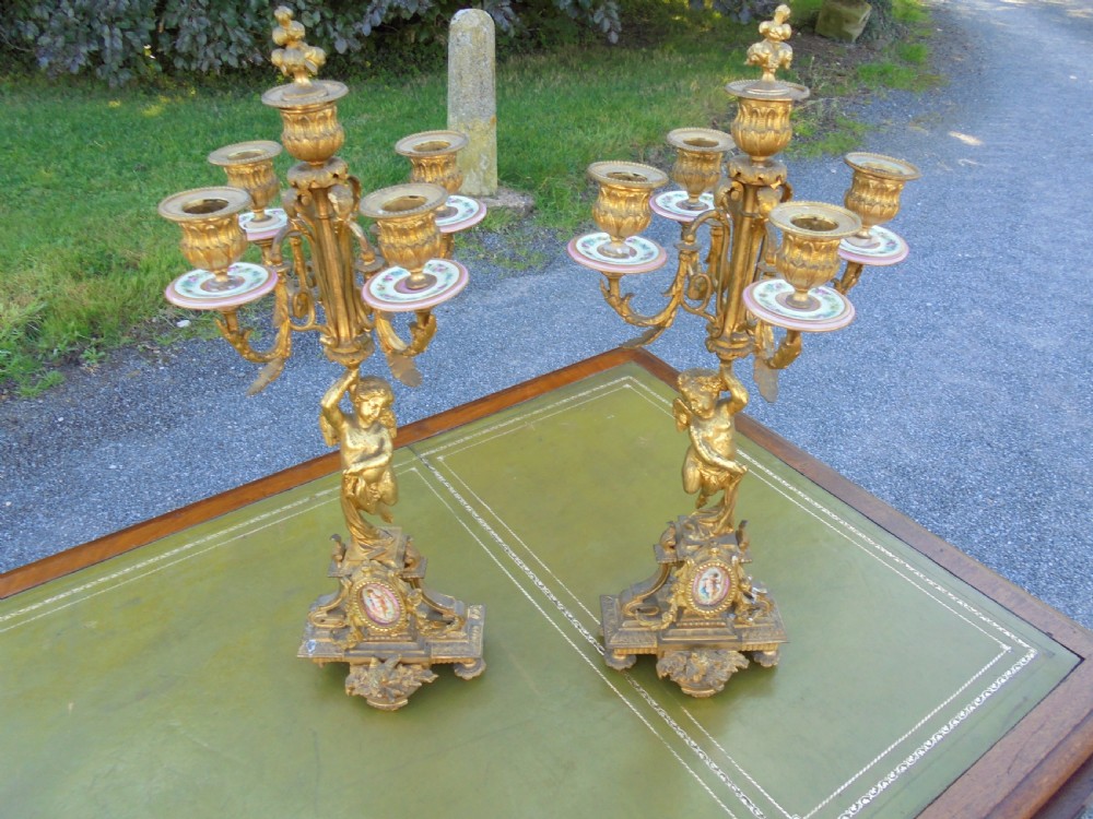 Pair of 19th century gilded bronze candelabra  with Sevres plaques