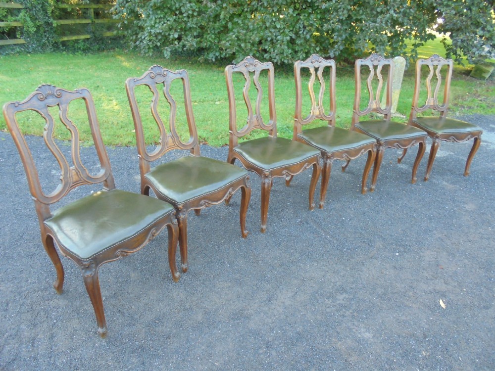 Set of six French carved oak dining chairs with leather seats and high back View VI