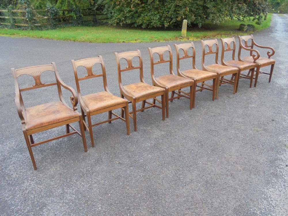 Set of eight (six plus two) Regency mahogany leather seat dining chairs