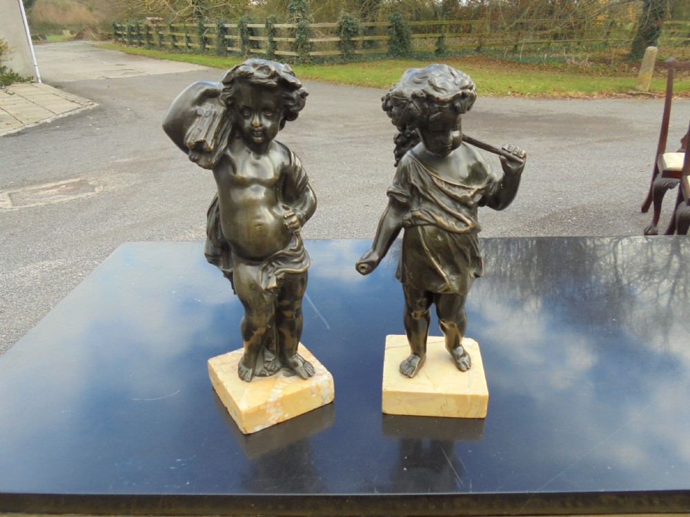 Pair 19th century bronze boy and girl figures