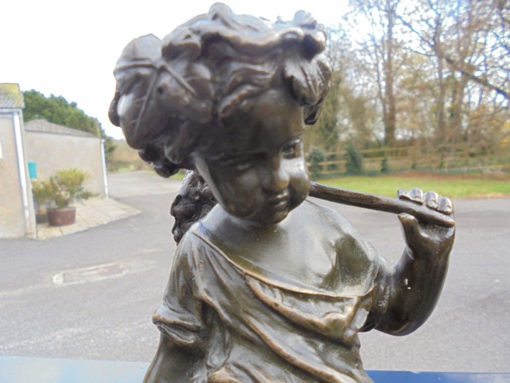 Pair 19th century bronze boy and girl figures View II