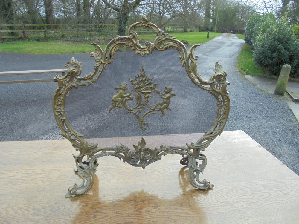 French 19th century ornate fire screen , gilded bronze