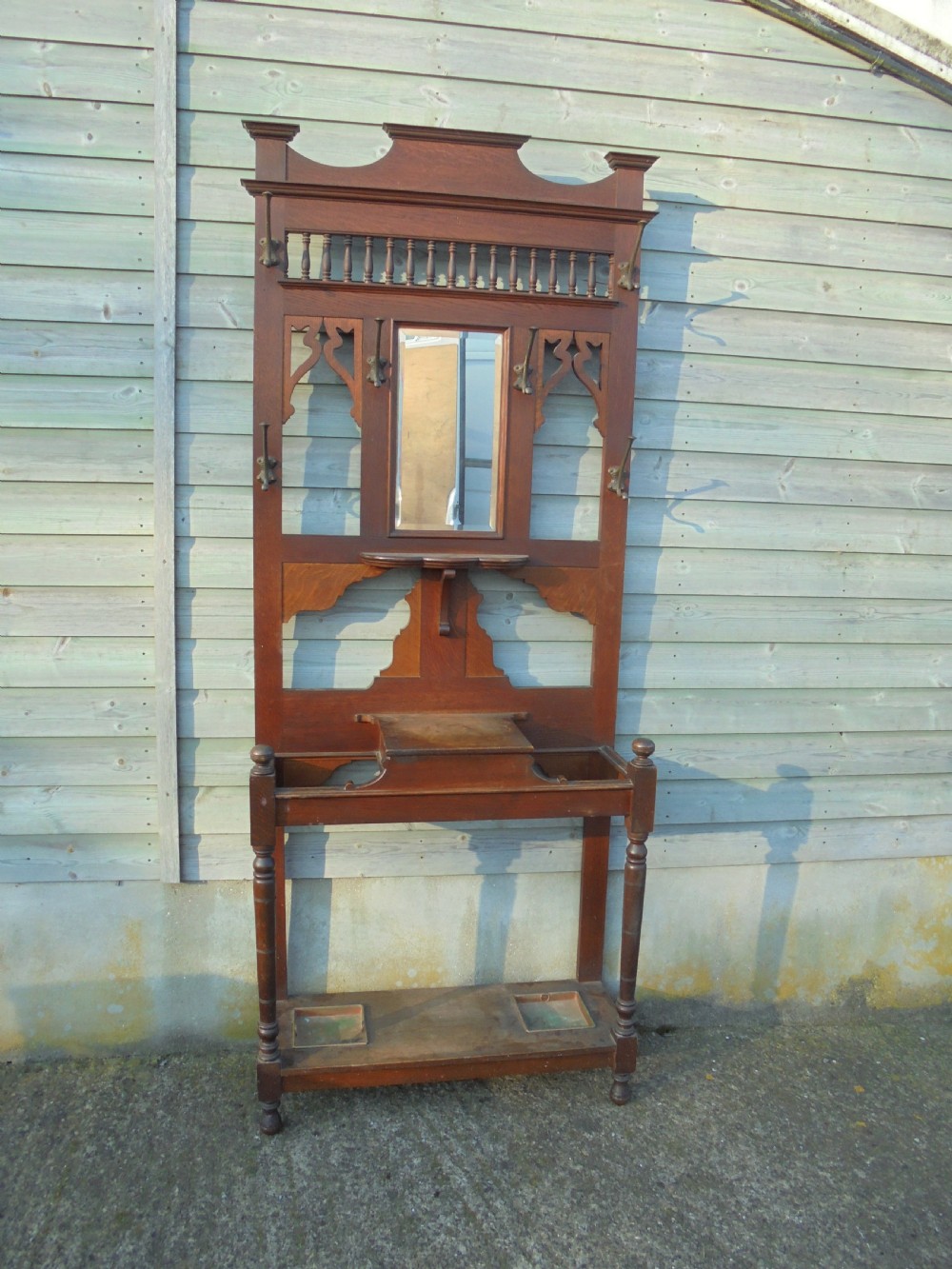19th century oak hall stand with beaten metal hooks