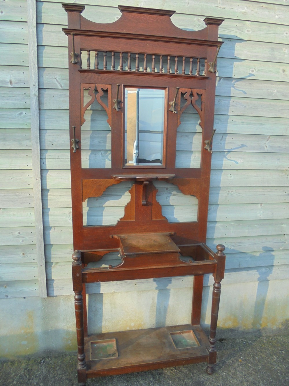 19th century oak hall stand with beaten metal hooks View II