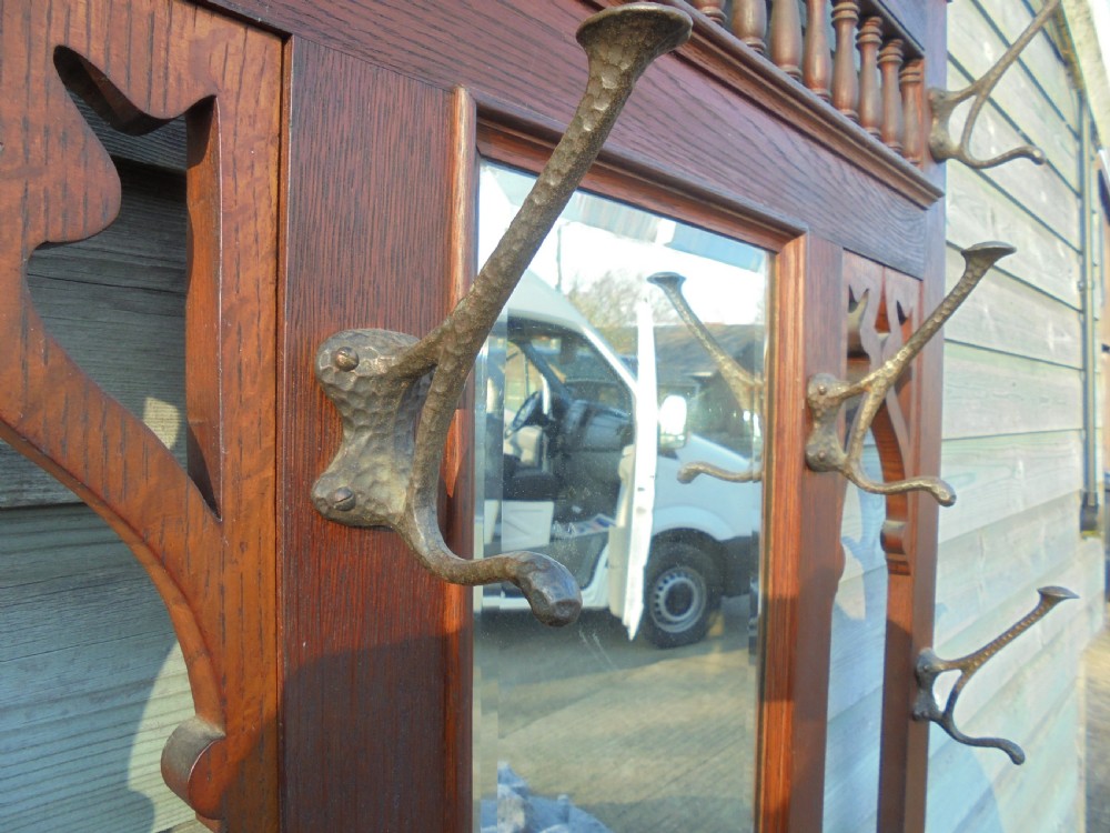 19th century oak hall stand with beaten metal hooks View III