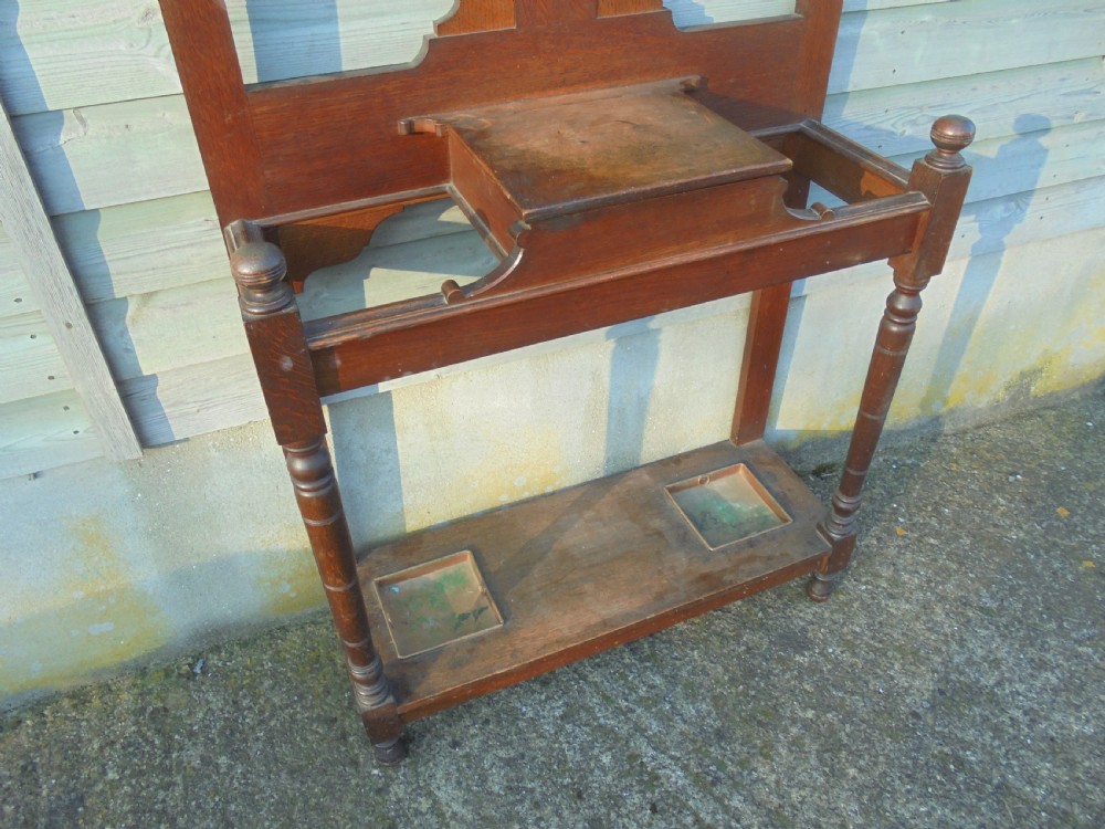 19th century oak hall stand with beaten metal hooks View V