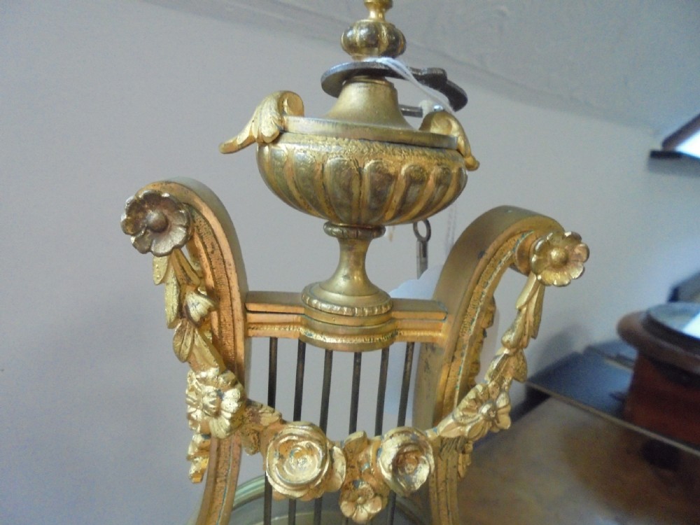 French Lyre shape gilded mantle clock with jewelled bezel View II