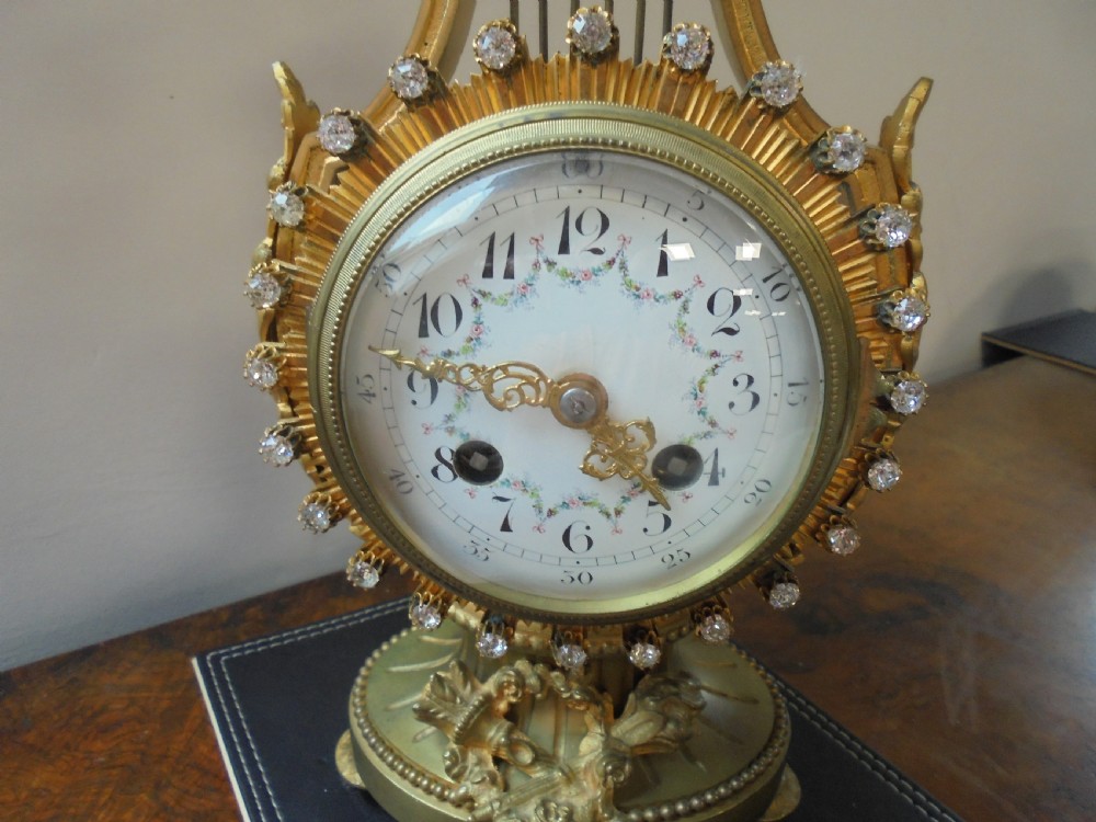 French Lyre shape gilded mantle clock with jewelled bezel View III