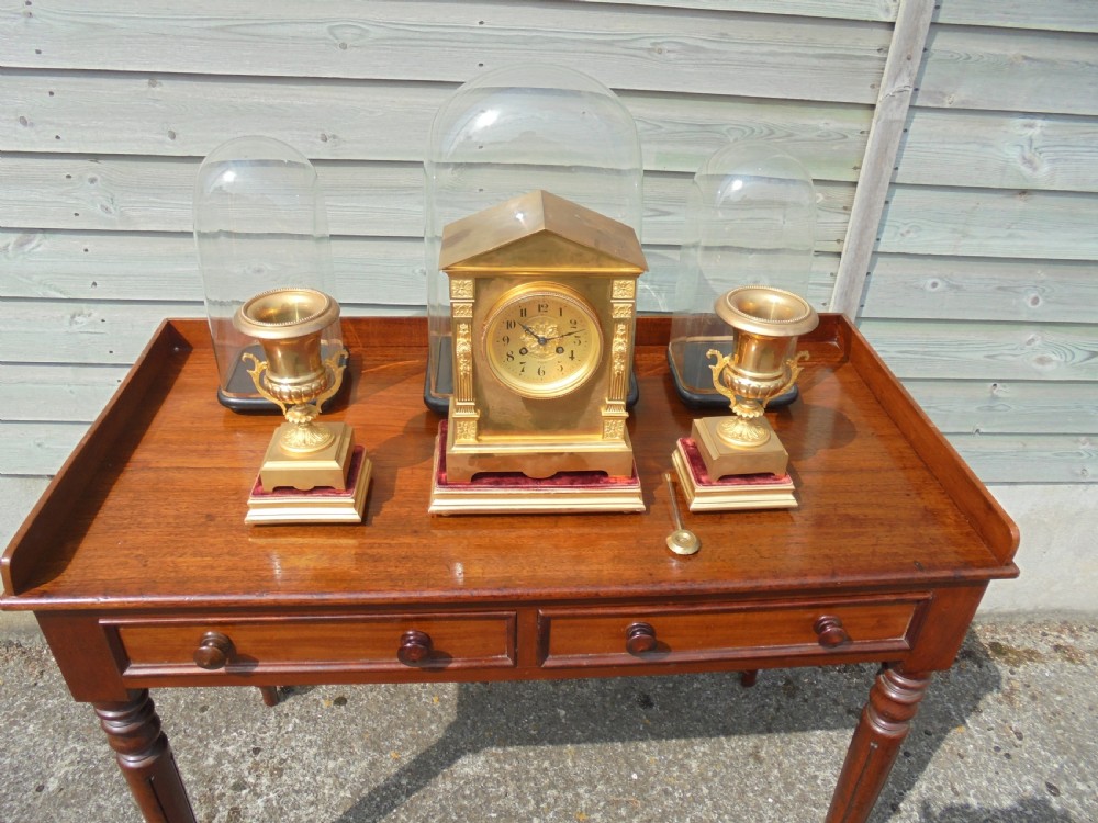 Three piece French brass clock set with original domes View III