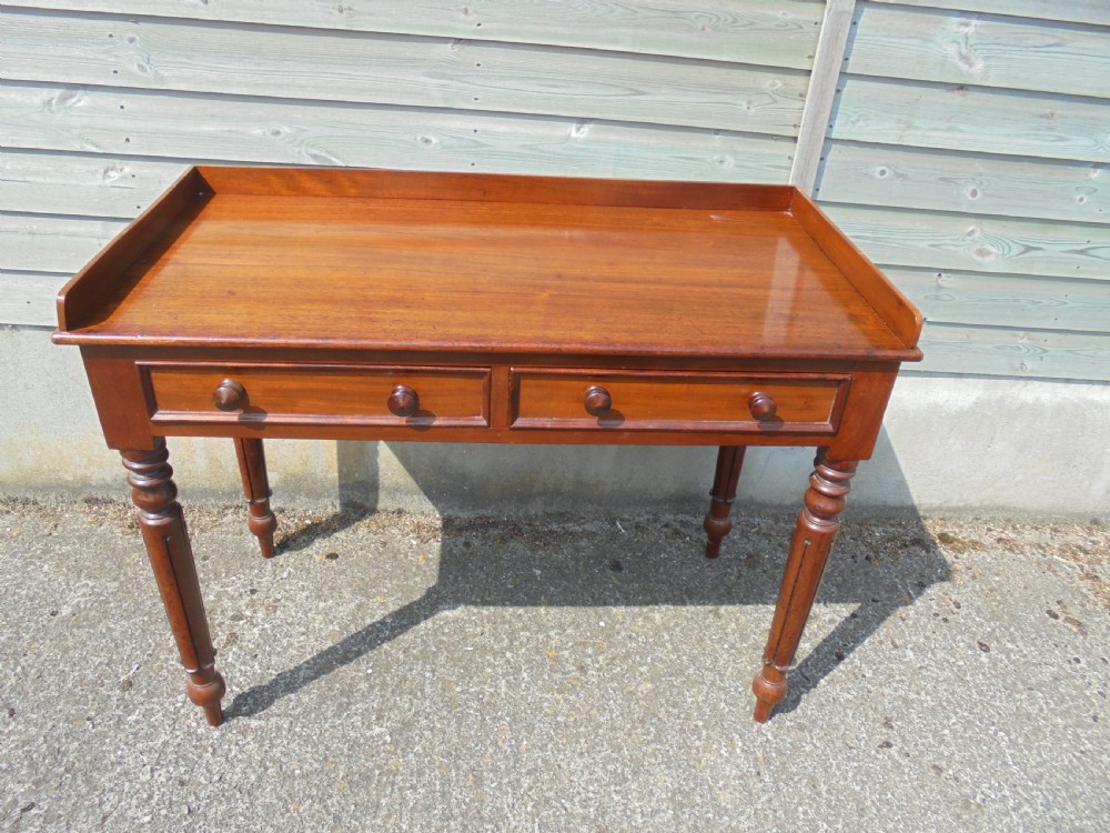 Mid Victorian two drawer mahogany writing table View II