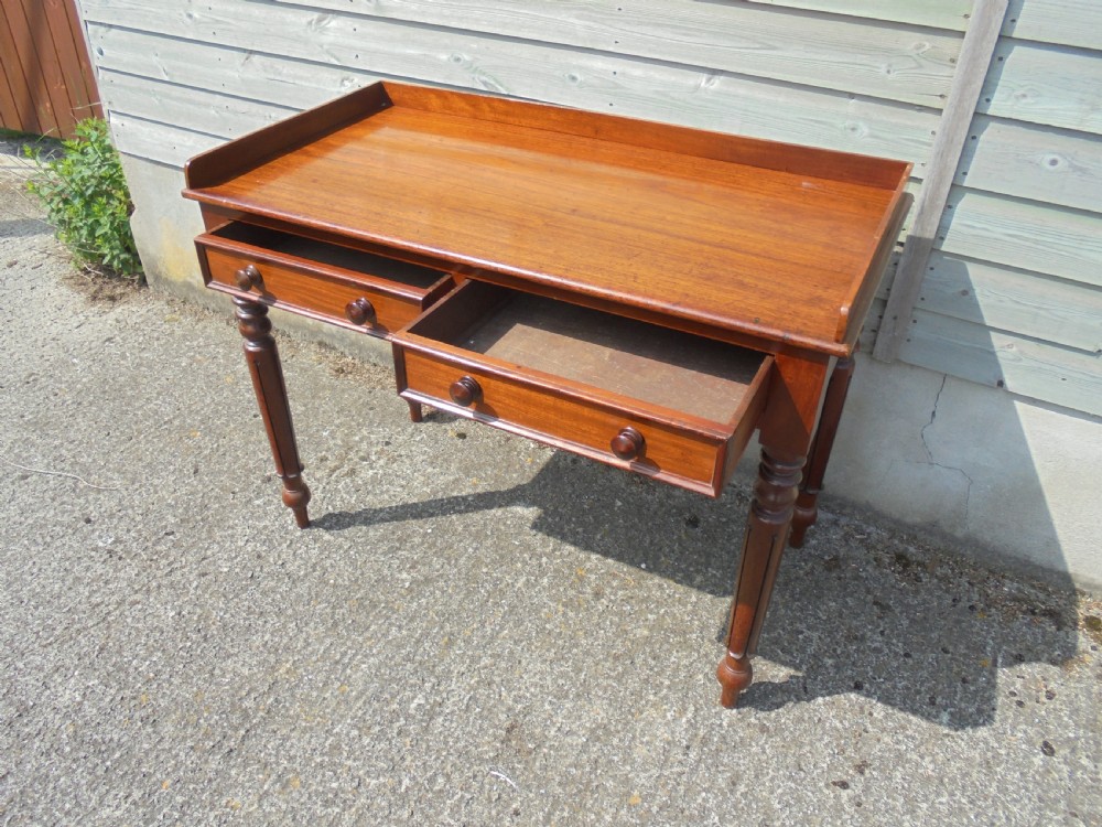 Mid Victorian two drawer mahogany writing table View III