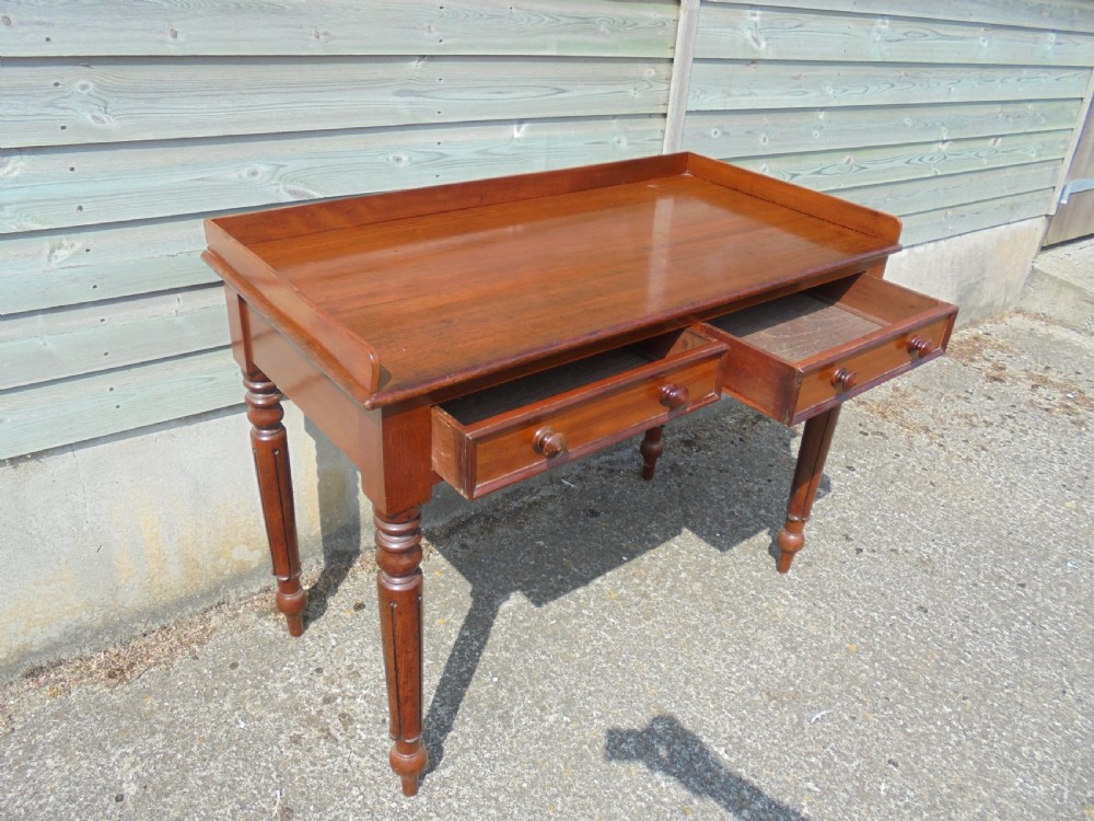 Mid Victorian two drawer mahogany writing table View V