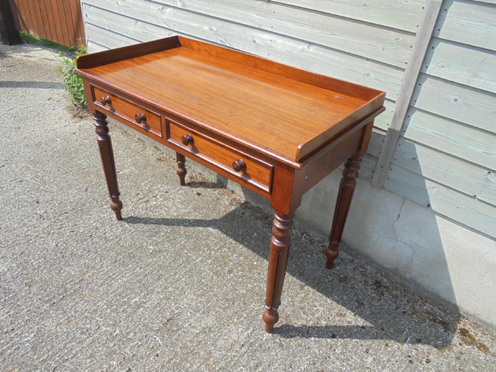 Mid Victorian two drawer mahogany writing table View VI