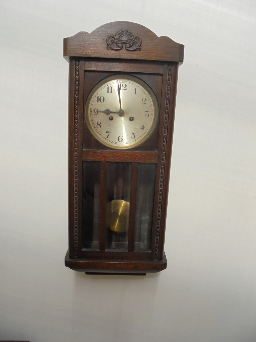 Eight day oak bevelled door wall clock View II