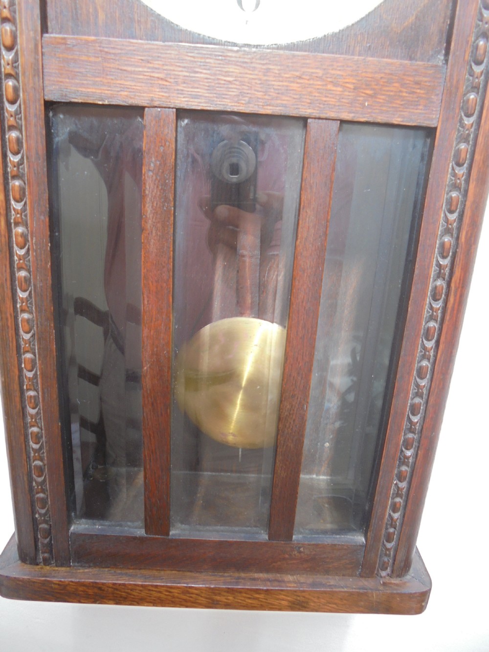 Eight day oak bevelled door wall clock View V