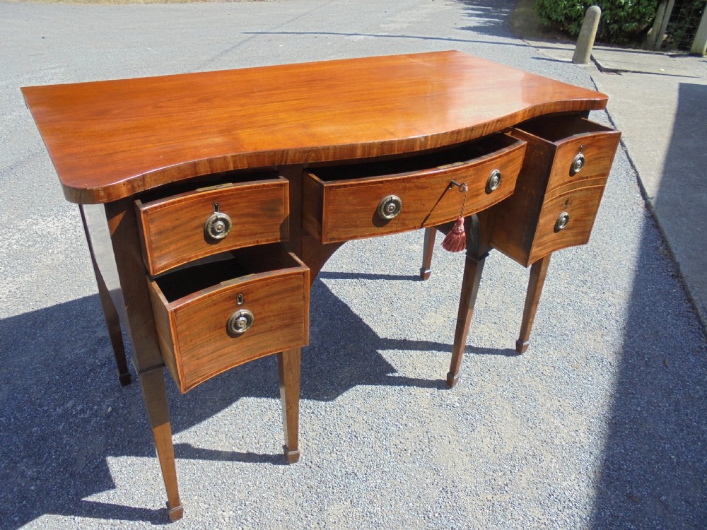 Classic 18th century mahogany serpentine sideboard View IV