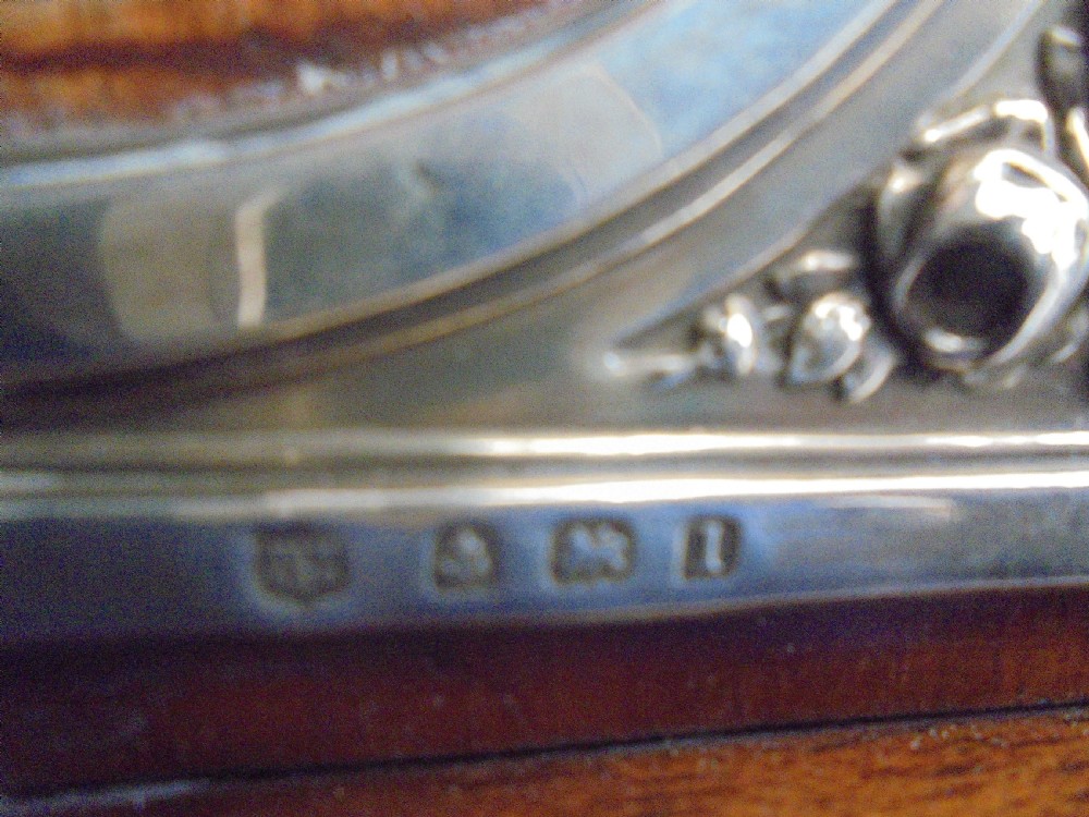 Silver Art Nouveau miniature clock . Hall marked View V