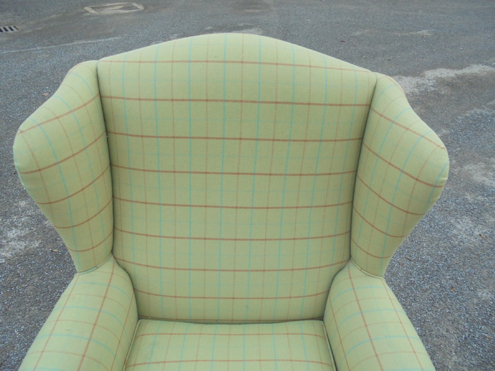 Upholstered winged armchair View II