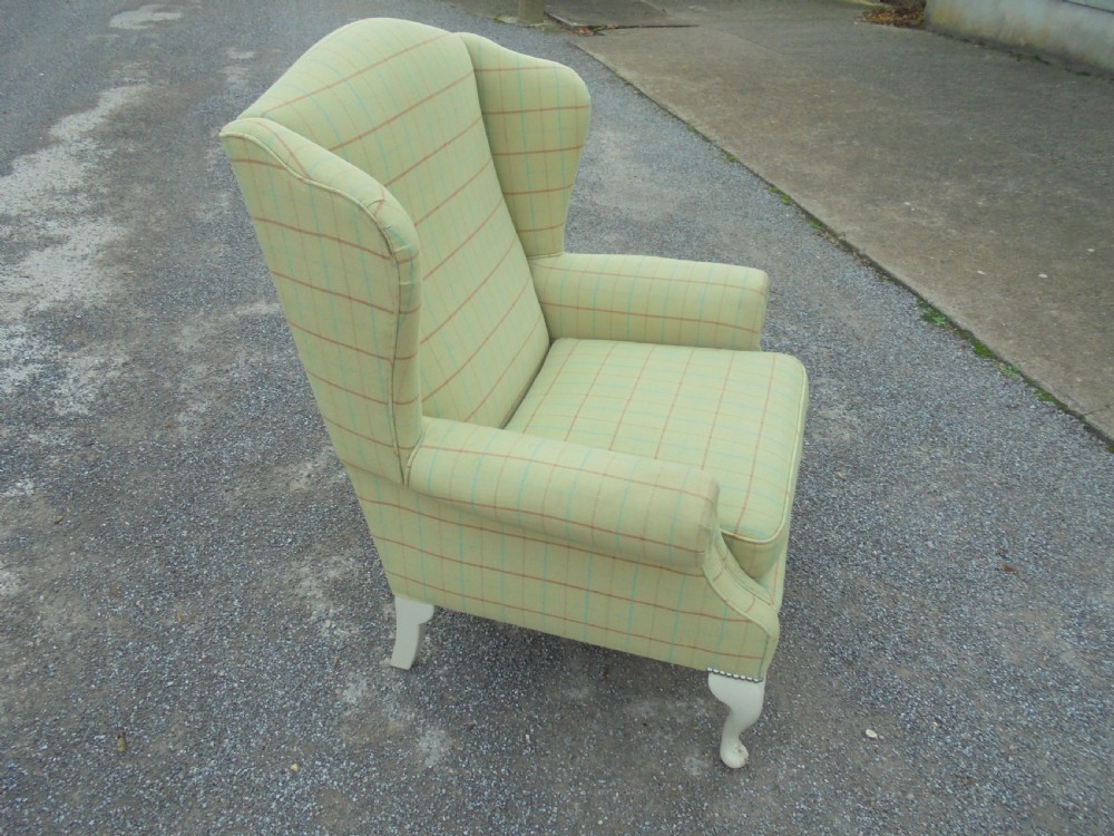 Upholstered winged armchair View III