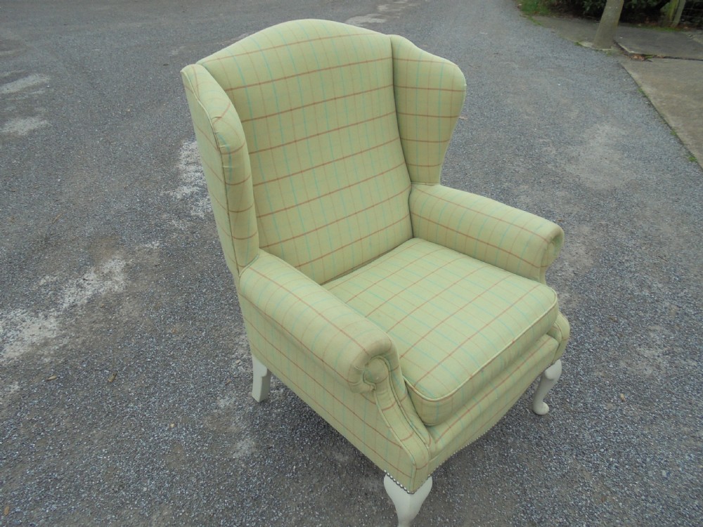 Upholstered winged armchair View V