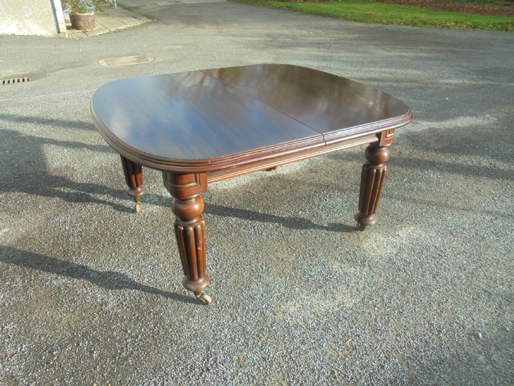 19th century mahogany two leaf extending dining table Seats ten View II