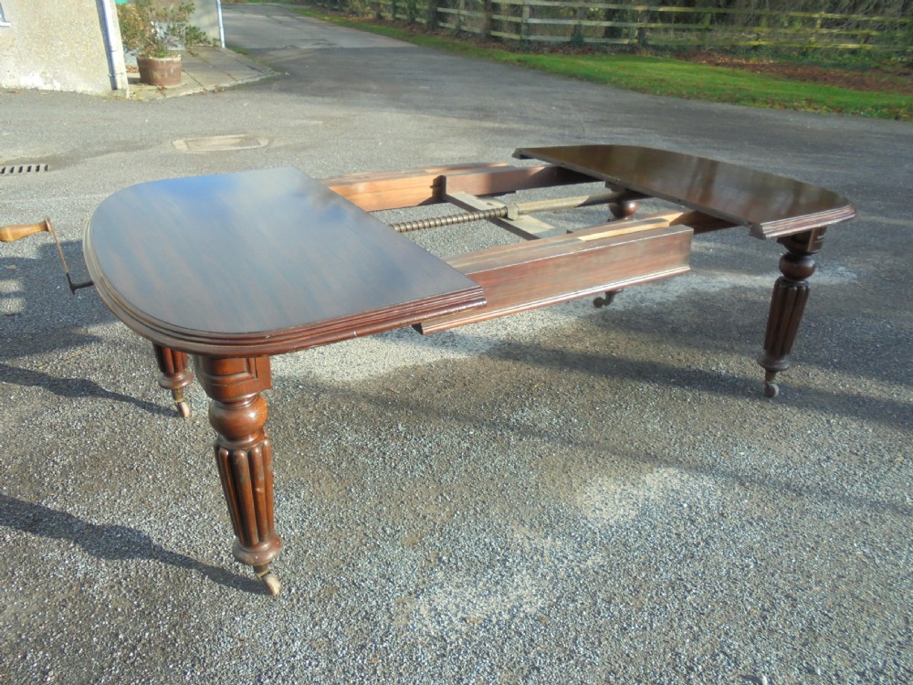 19th century mahogany two leaf extending dining table Seats ten View III