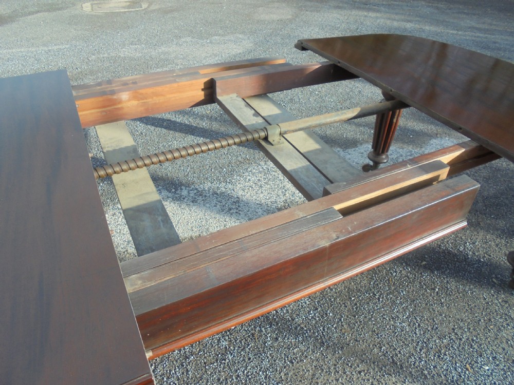 19th century mahogany two leaf extending dining table Seats ten View IV