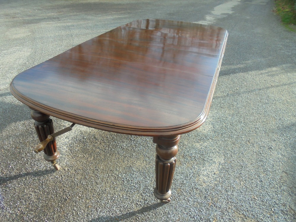 19th century mahogany two leaf extending dining table Seats ten View VII